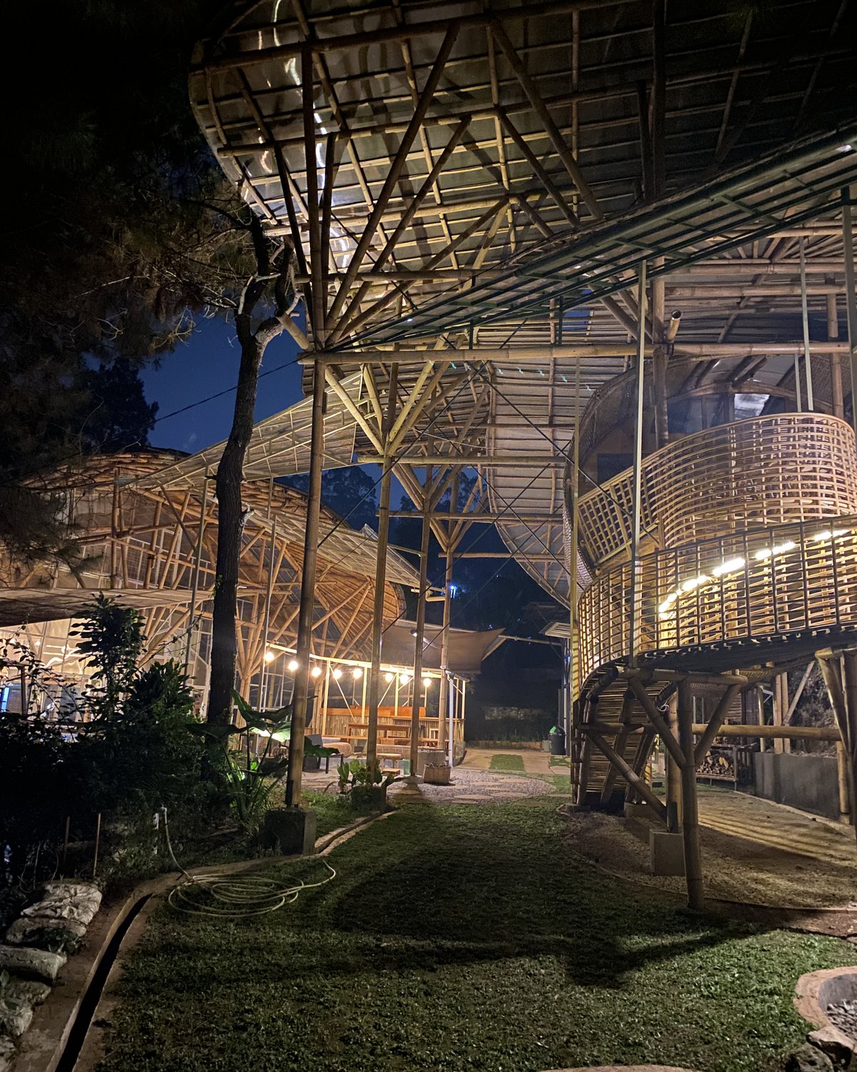 The grounds lit up at night, ready for a private gathering