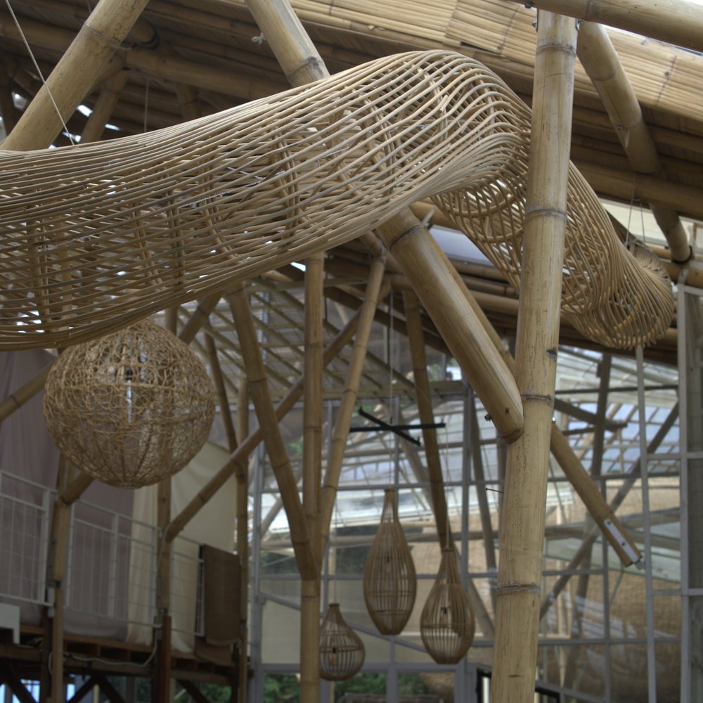 Woven rattan light fixtures hanging from the ceiling